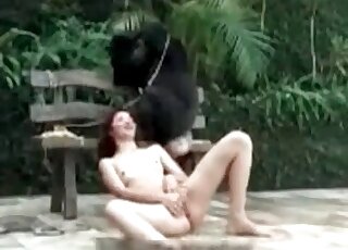 Horny sluts is busy fingering her pussy in front of a fluffy dog