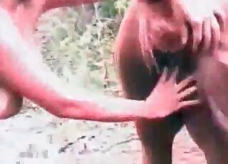 Filthy slut licks pussy hole of a horse and prepares for sex outdoors