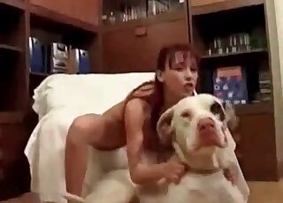 Big white dog gets seduced by a slender zoophile bitch for sex