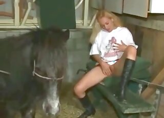 Horny blonde girl masturbates in front of hot horse