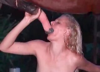 Huge cock of a horse arouses horny blonde for a passionate blowjob