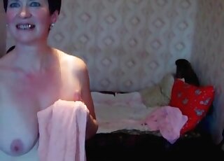 Shameless mature slut gets naked to give her twat to her trained dog