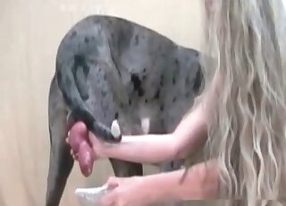 Long-haired mature nymph wanks to her huge dog to make it horny