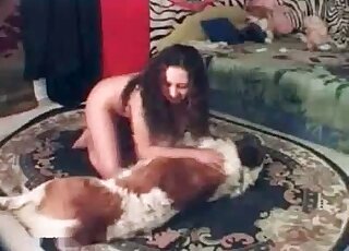 Brunette kinky slut starts making out with her curly dog at home