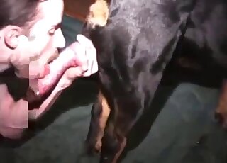 Hot famer guy with dark hair sucking on that dog's juicy penis